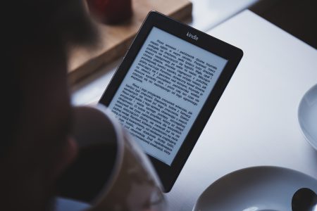 Reading on Kindle - free stock photo