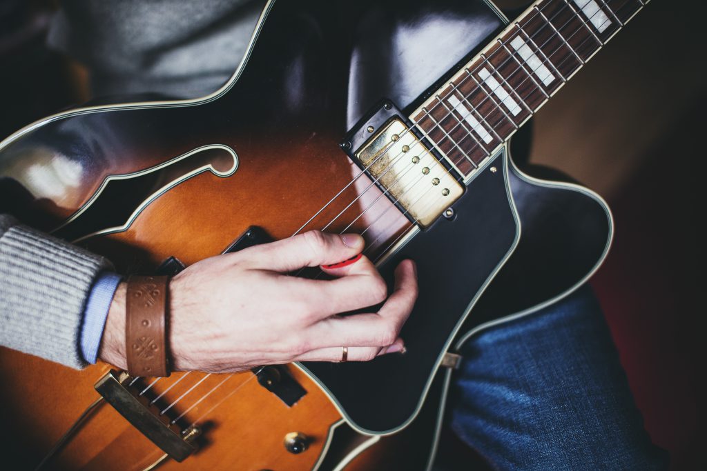 Playing guitar – front shot - free stock photo