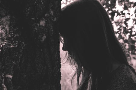 Girl leaning against the tree - free stock photo