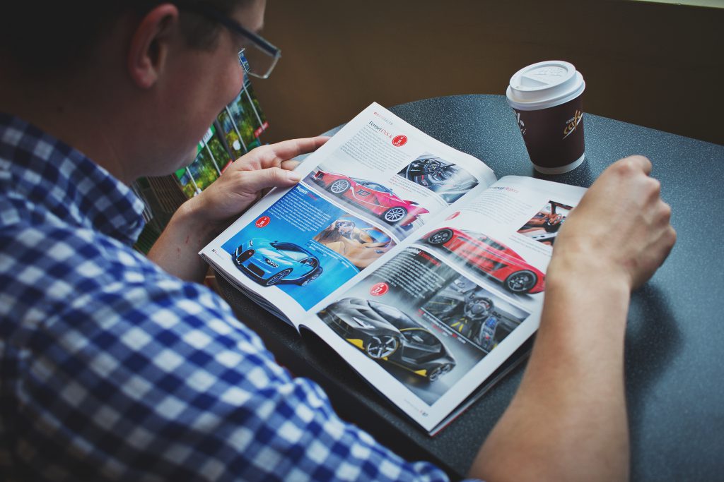 Man reading a magazine - free stock photo