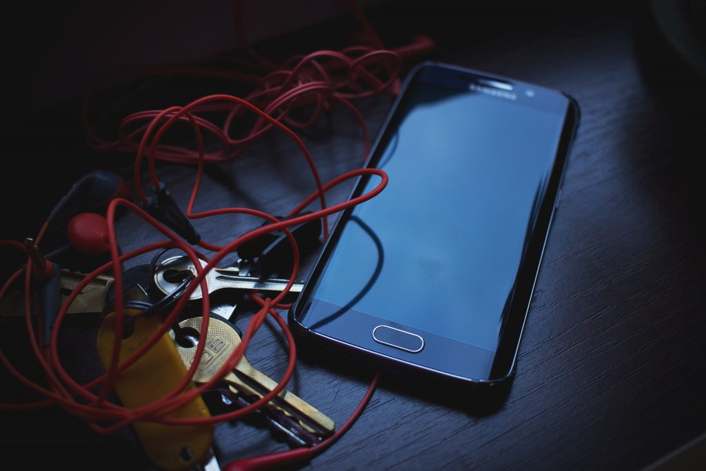 Phone, headphones and keys - free stock photo