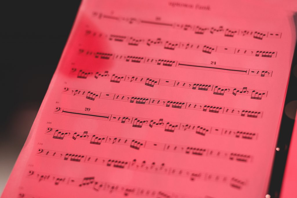 Sheet music in red light - free stock photo