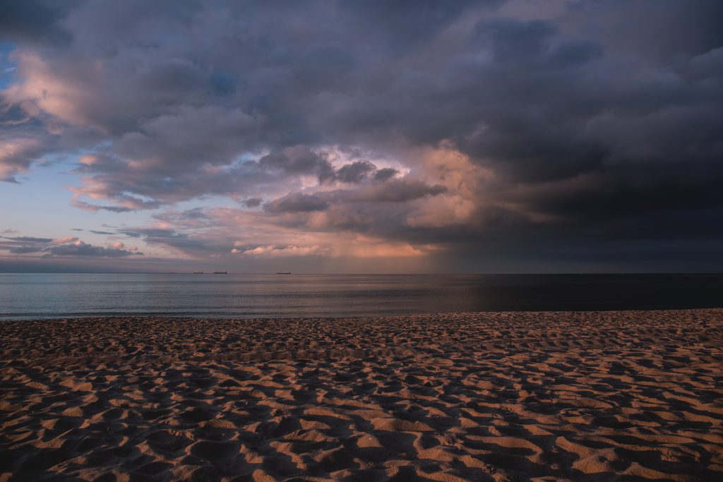 Sunny clouds at the seaside - free stock photo