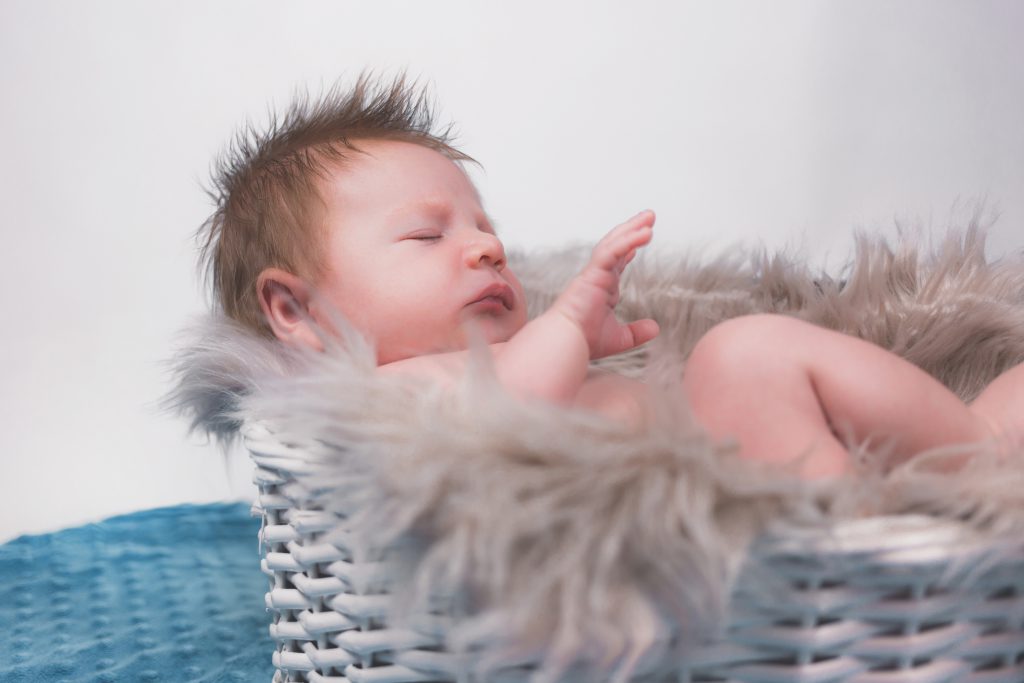 Baby in a basket - free stock photo