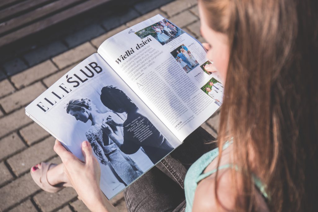 Girl reading a magazine - free stock photo