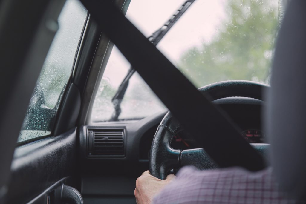 Man driving on rainy day