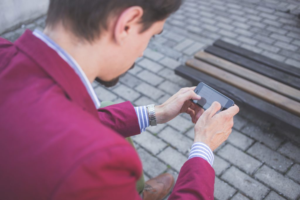 Man using his phone - free stock photo