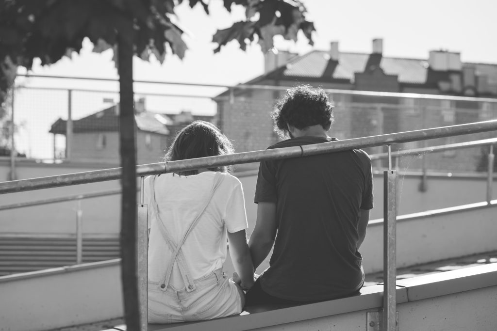 Sitting couple in black and white - free stock photo