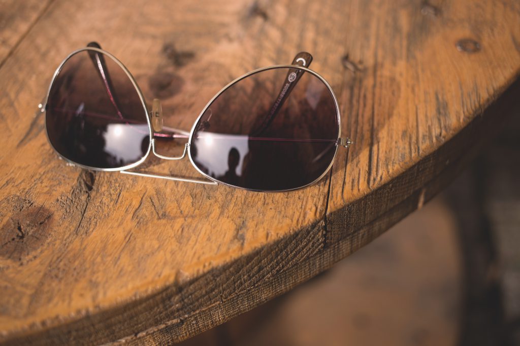 Sunglasses on a table - free stock photo