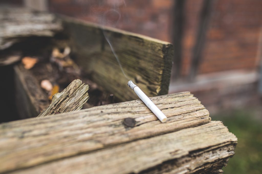 Cigarette on wood - free stock photo