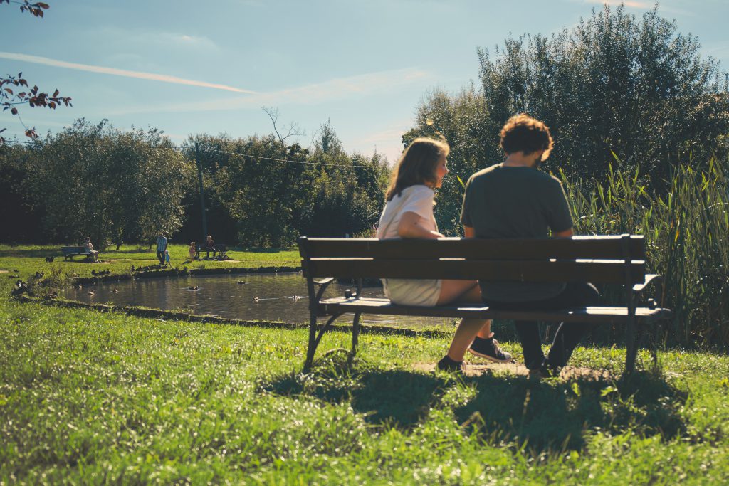 Couple sitting on a bench - free stock photo