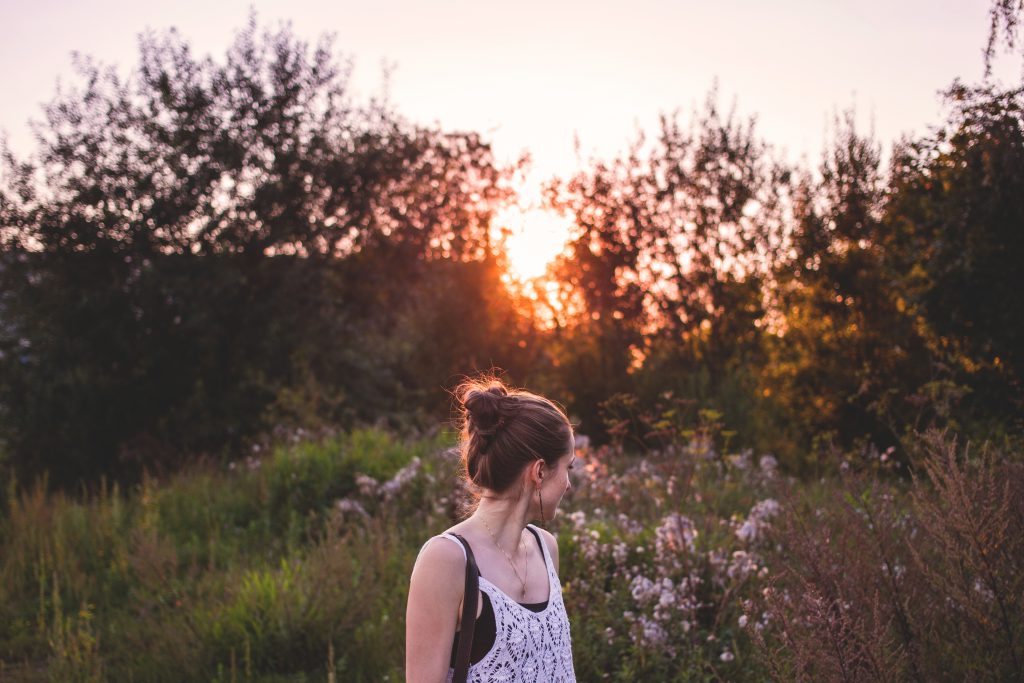 Girl looking back at sunset - free stock photo