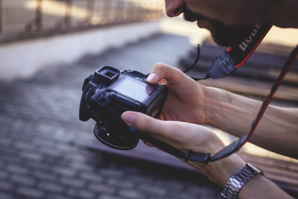 Man holding a camera 2 - free stock photo