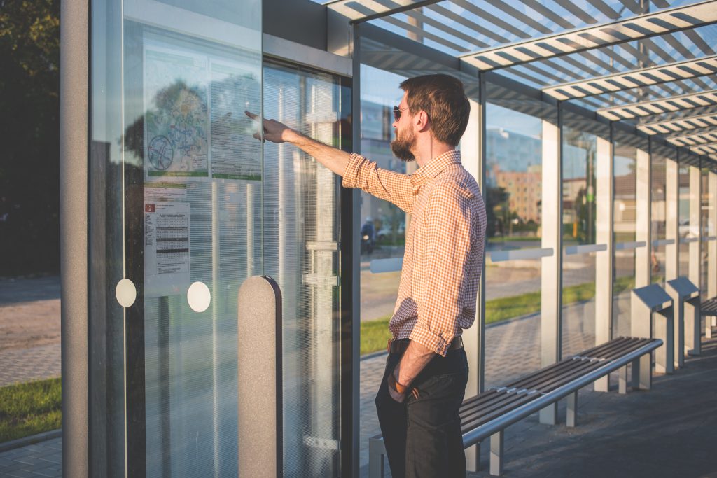 Man standing at tram stop - free stock photo