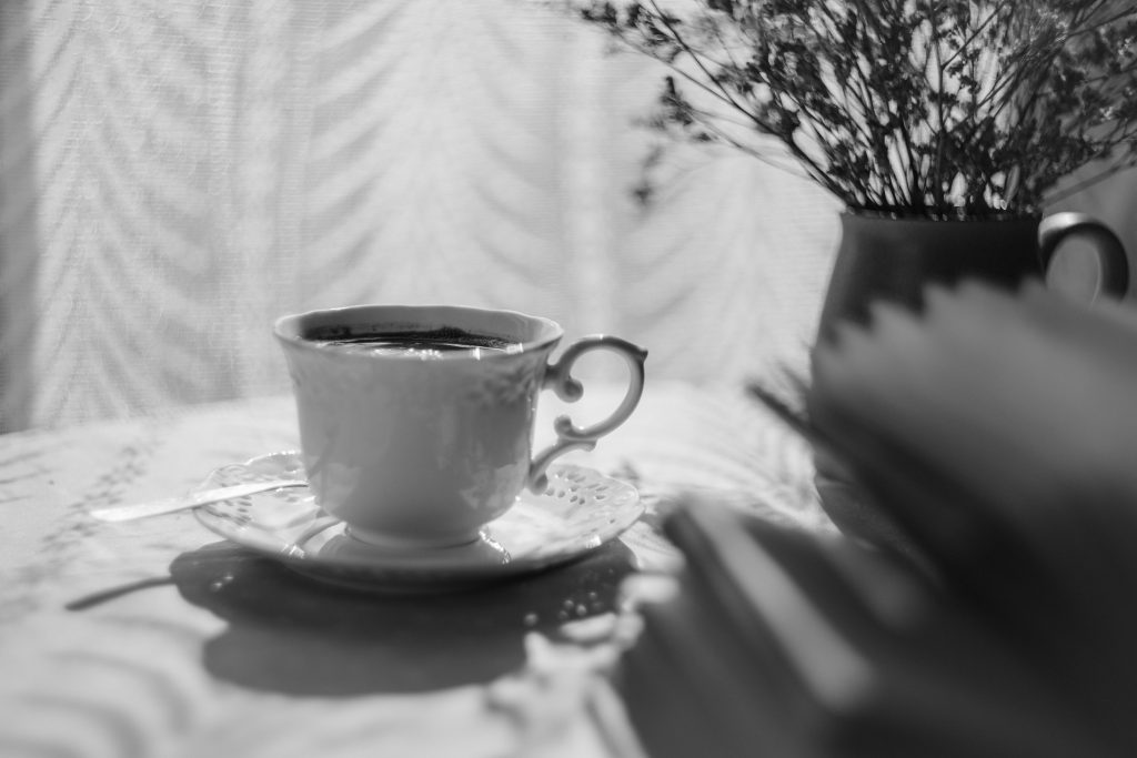 Open book and a cup of coffee - free stock photo