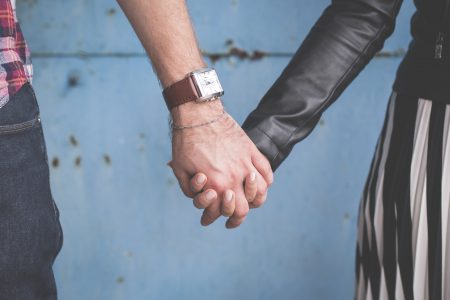 Standing couple holding hands - free stock photo