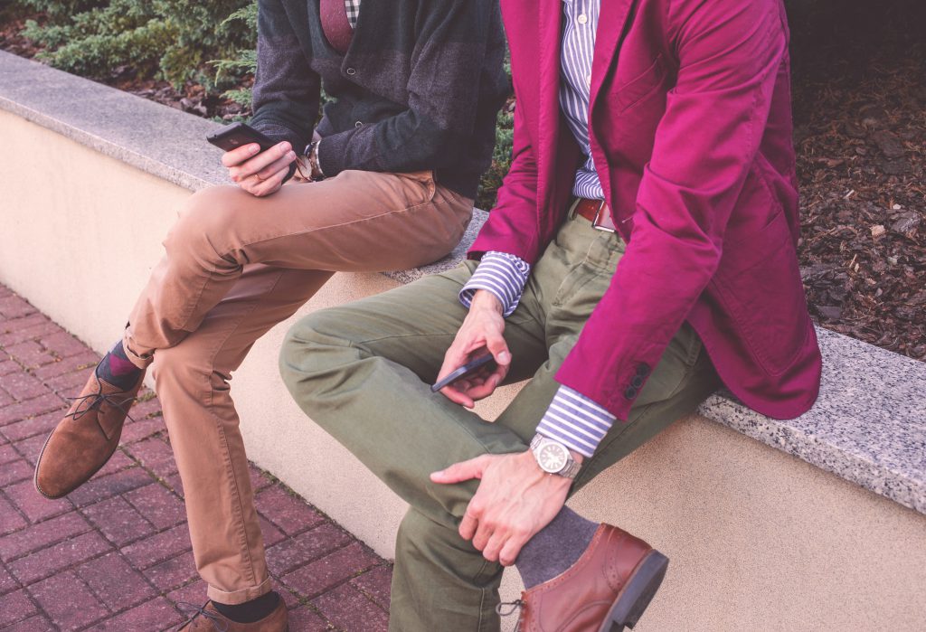 Two sitting men with phones - free stock photo