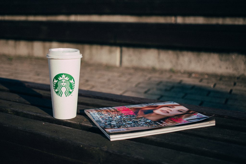 coffee and a magazine on a bench 1024x683 - Boost Your Mood at your workplace With Yellow