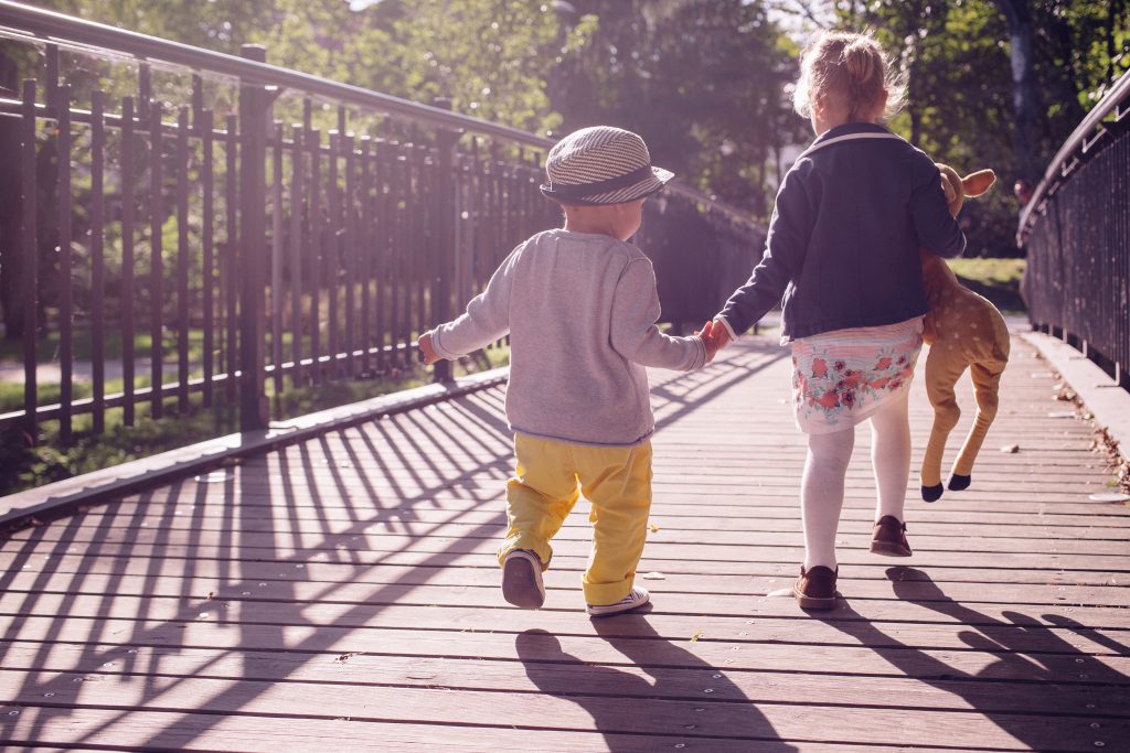 Kids running across the bridge - free stock photo