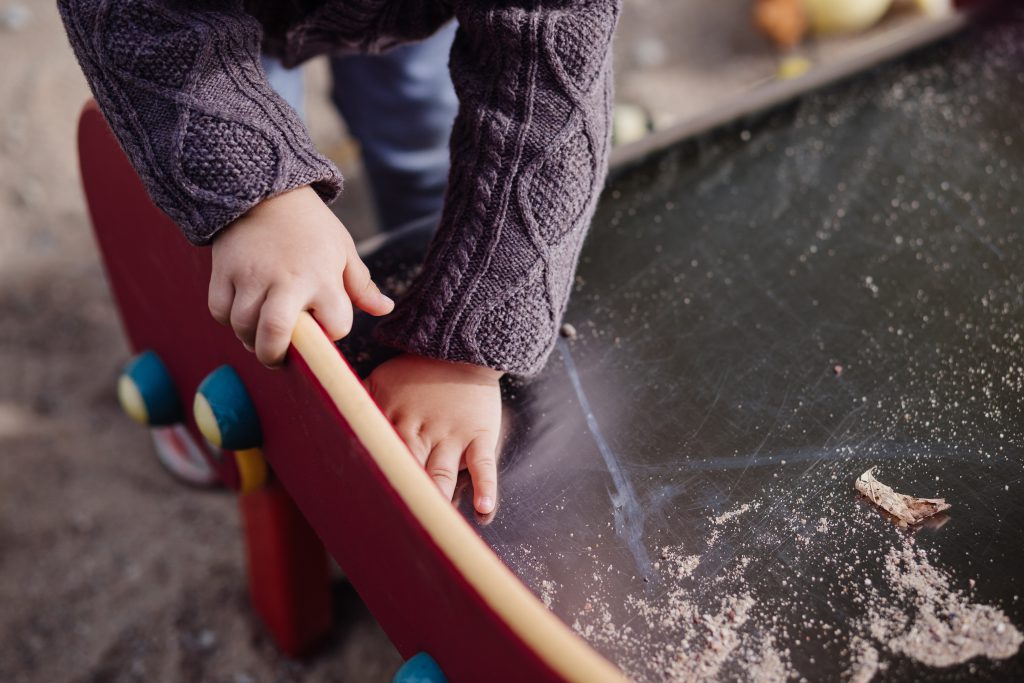 child_cleaning_the_slide-1024x683.jpg