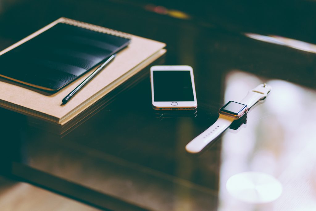 iPhone, iWatch and notebook - free stock photo