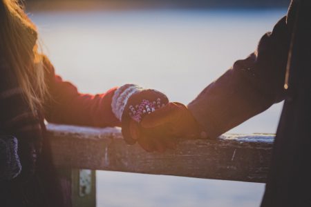 A couple holding hands in winter - free stock photo