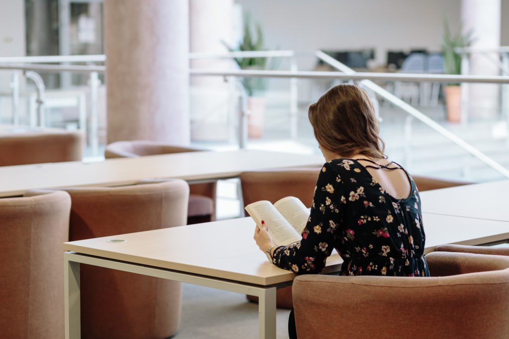 Girl in a reading room - free stock photo