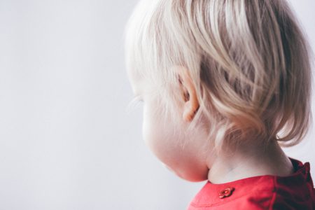 Little girl looking out the window - free stock photo
