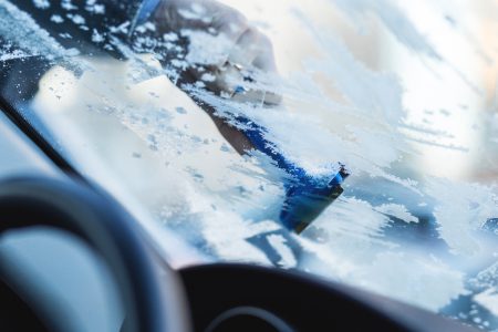 Removing frost from car windshield - free stock photo