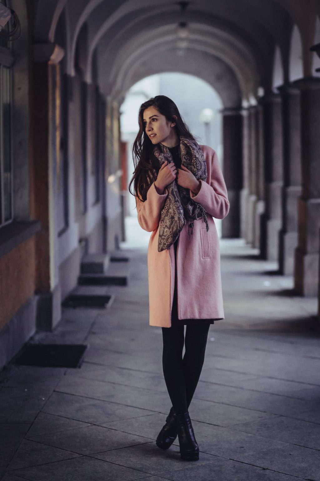 A woman posing under arcades - free stock photo