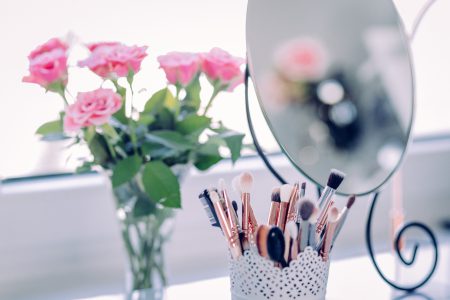 Makeup brushes and roses - free stock photo