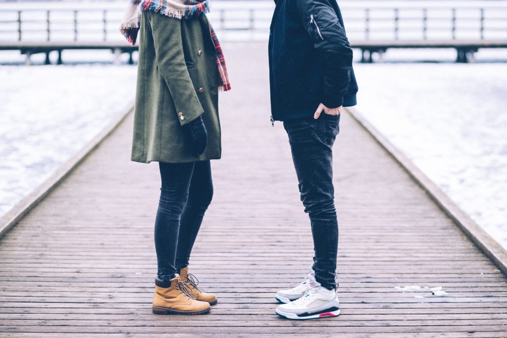 Two people standing on the pier - free stock photo