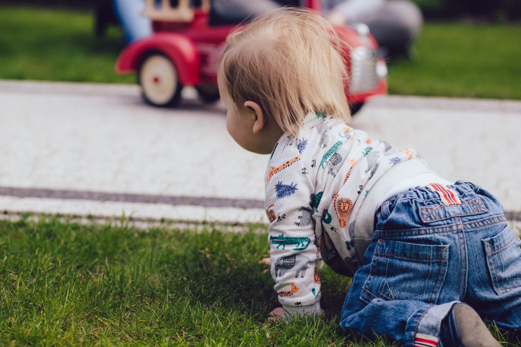 Baby boy crawling outdoors - free stock photo