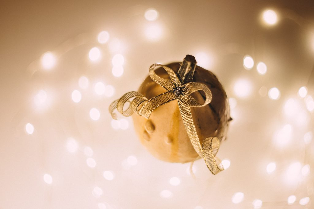 A halloween pumpkin with a spider jewel - free stock photo