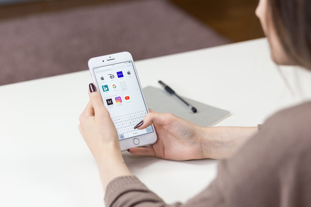 Female holding an iPhone 8 Plus 2 - free stock photo