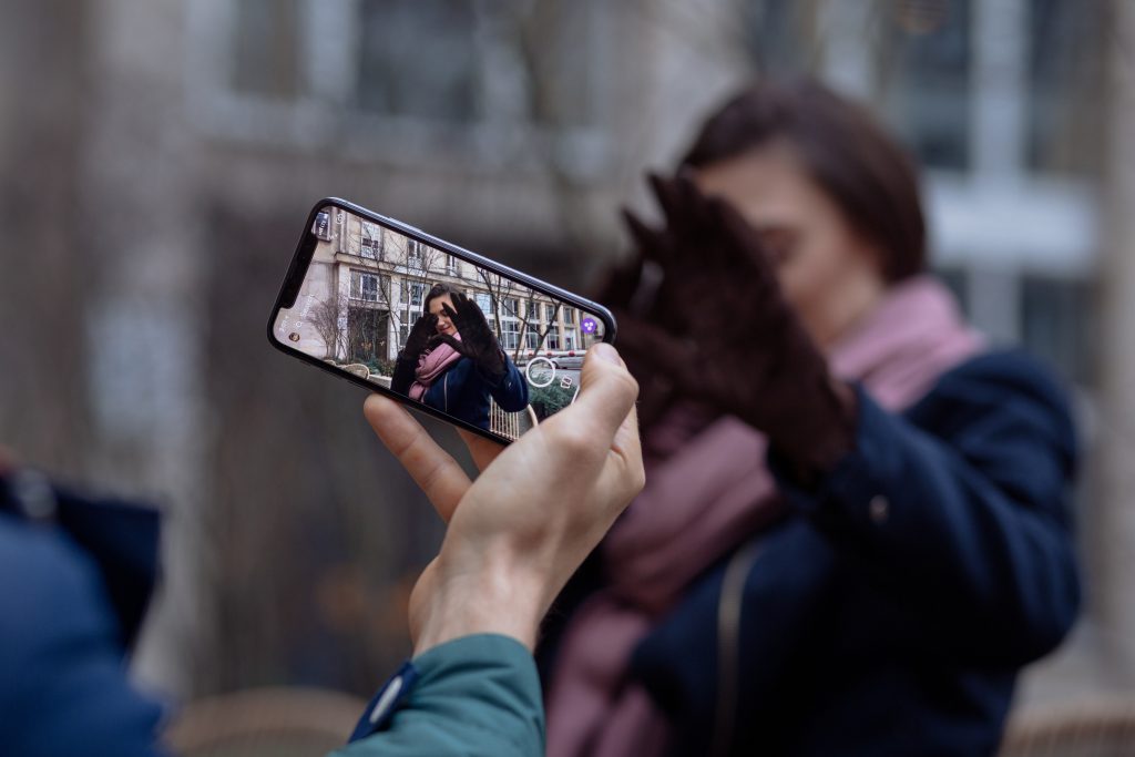 Taking a photo with an iPhone X - free stock photo