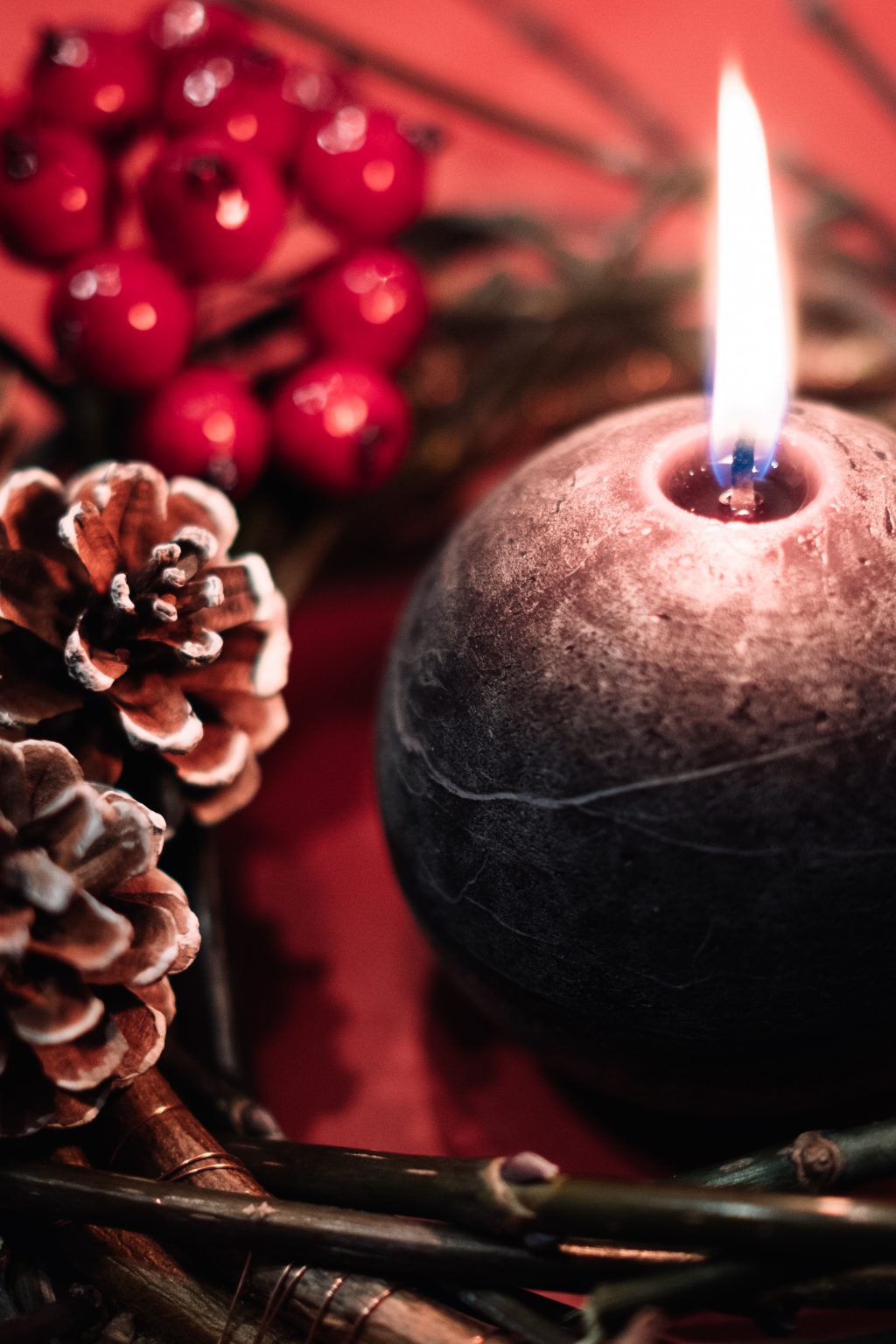 Christmas wreath and a round candle closeup - free stock photo