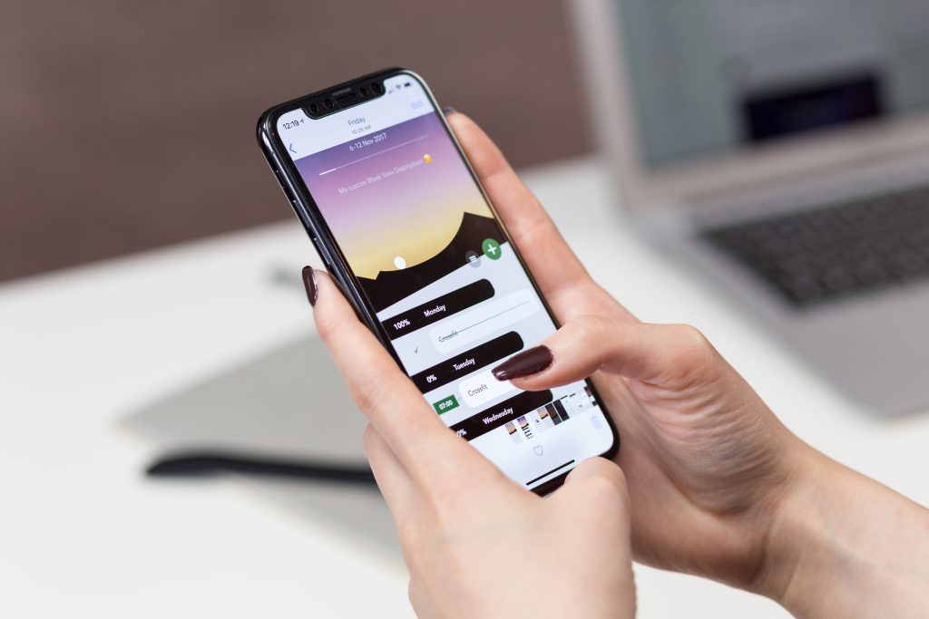 Take Action app on iPhone X - free stock photo