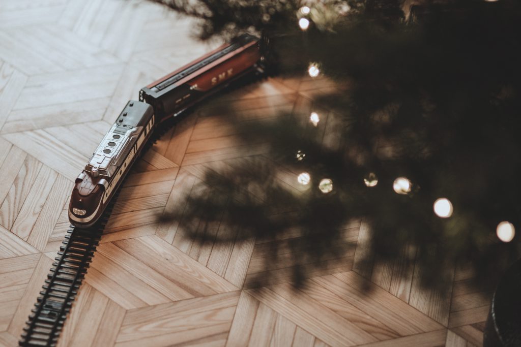 Toy train going around the Christmas tree 2 - free stock photo