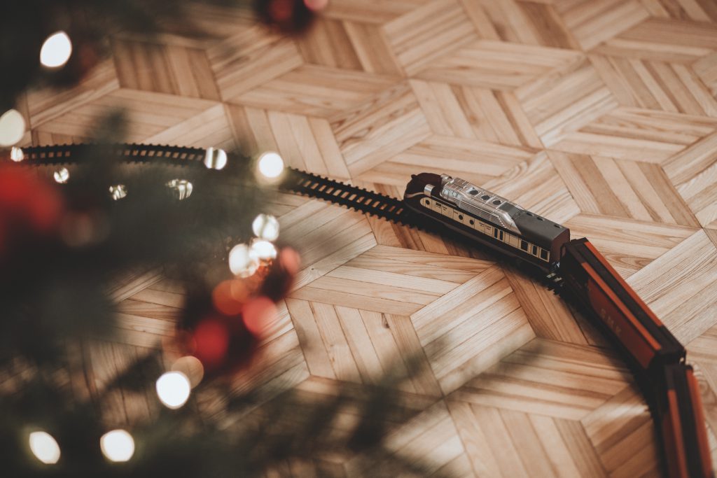 Toy train going around the Christmas tree 3 - free stock photo