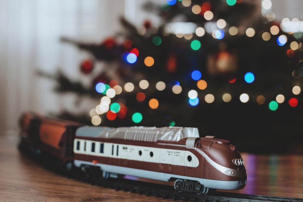 Toy train going around the Christmas tree 4 - free stock photo