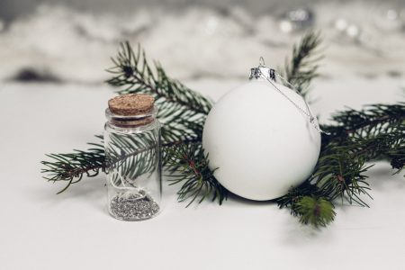 White and silver bauble with a spruce twig - free stock photo