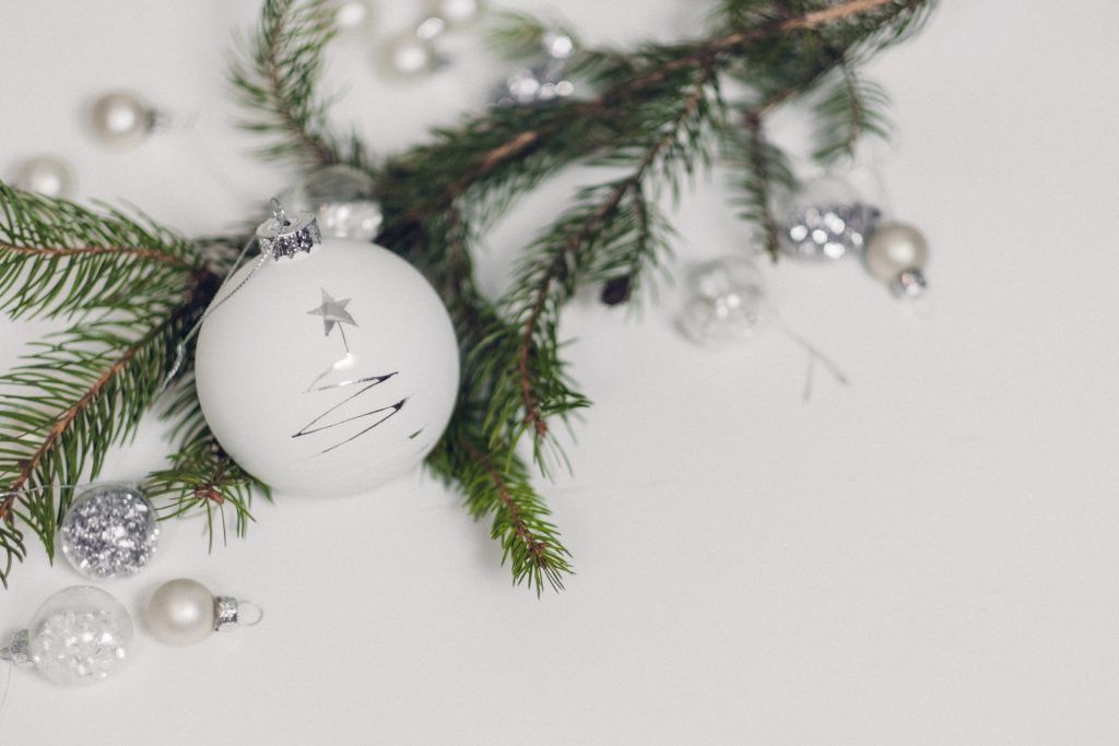 White and silver baubles with a spruce twig - free stock photo