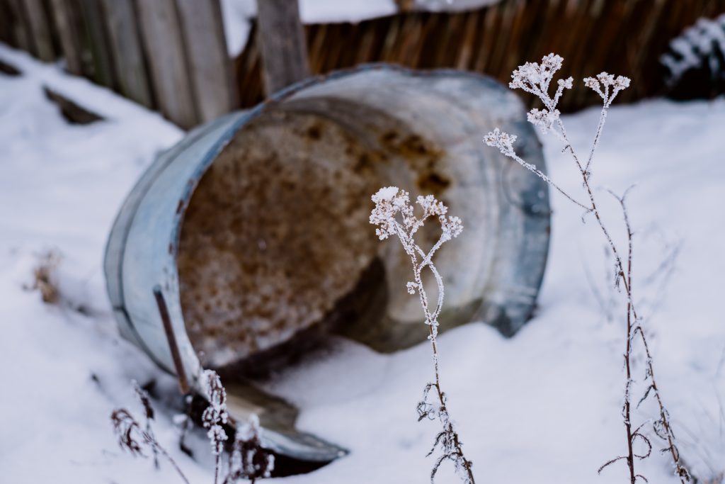 Frozen water in a rusted metal tub - free stock photo