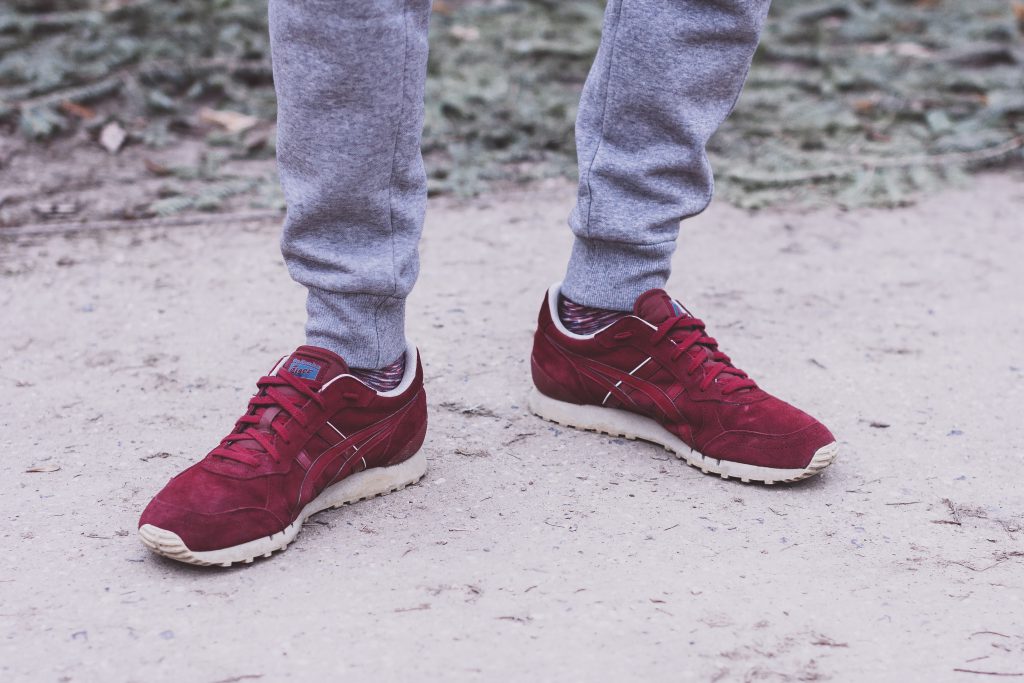 Male feet in red snickers - free stock photo