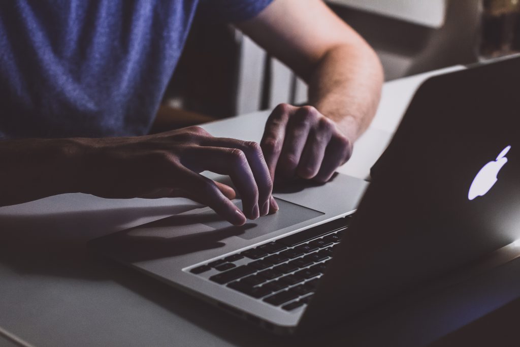 Man using a MacBook - free stock photo