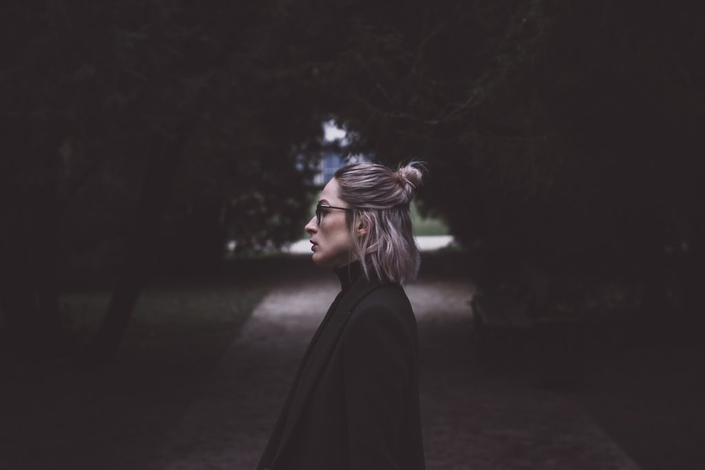 Moody outdoor female profile portrait - free stock photo