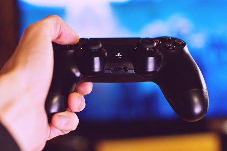PlayStation pad in a male hand - free stock photo
