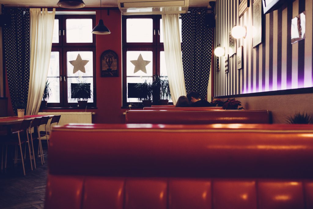 A couple in a retro café - free stock photo