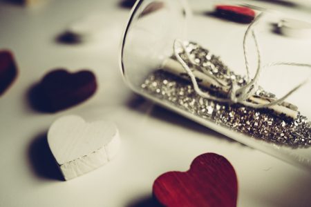 Message in a bottle and wooden hearts - free stock photo